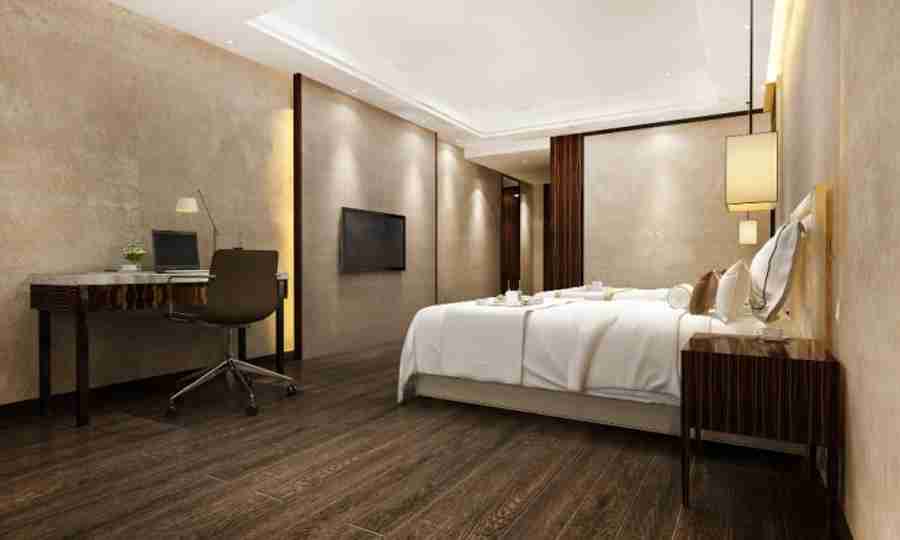 3d rendering beautiful luxury bedroom suite in hotel with tv and working table 730x438 1