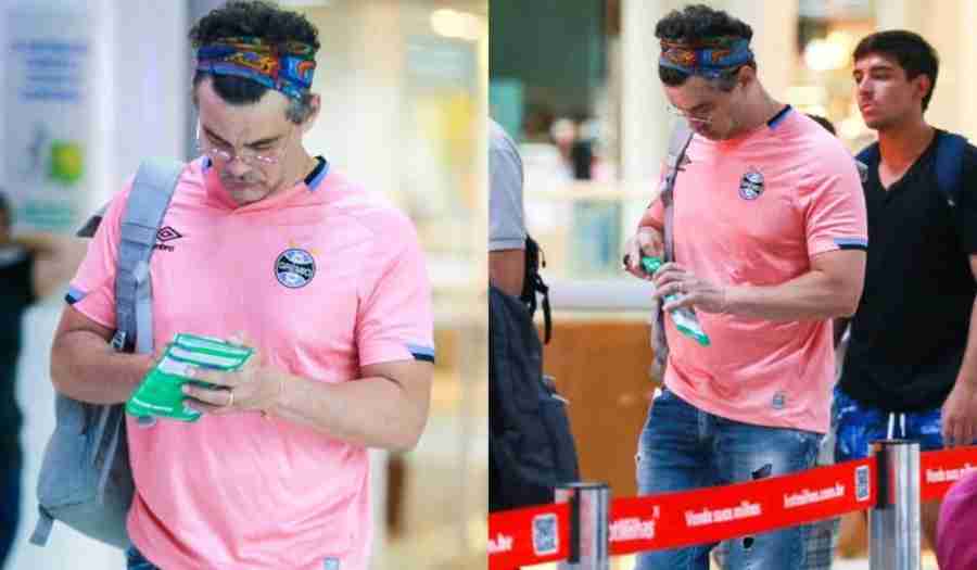 Carmo Dalla Vecchia usa camisa rosa do Grêmio em aeroporto (Foto: Agnews)